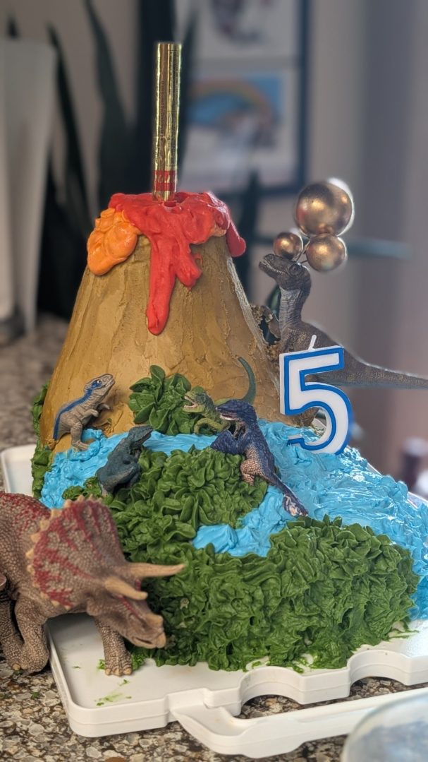 Custom sculpted cake, dinosaur themed with FIRE!!!